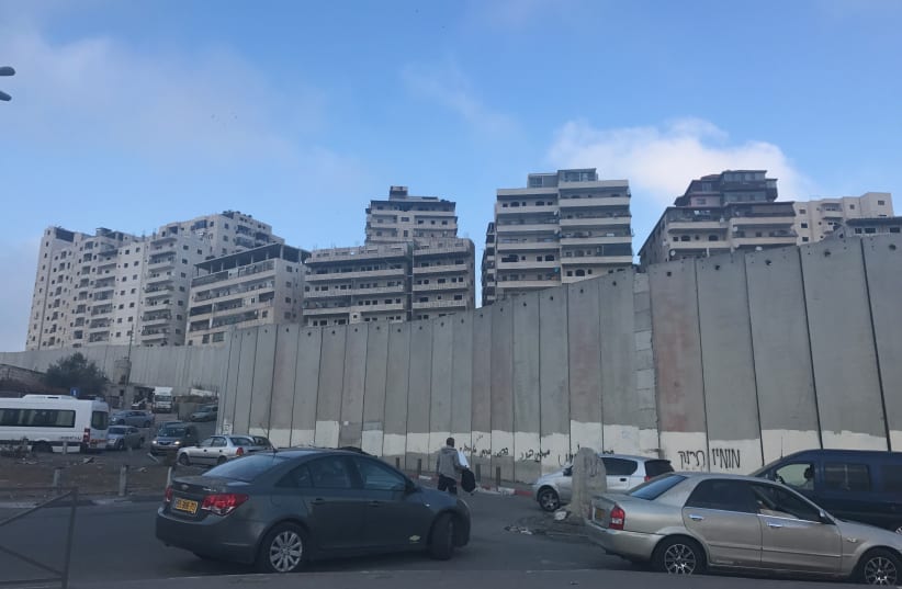 Buildings in Shuafat Refugee Camp, a Jerusalem neighborhood located behind the security barrier that would be affected by Elkin's plan (photo credit: UDI SHAHAM)