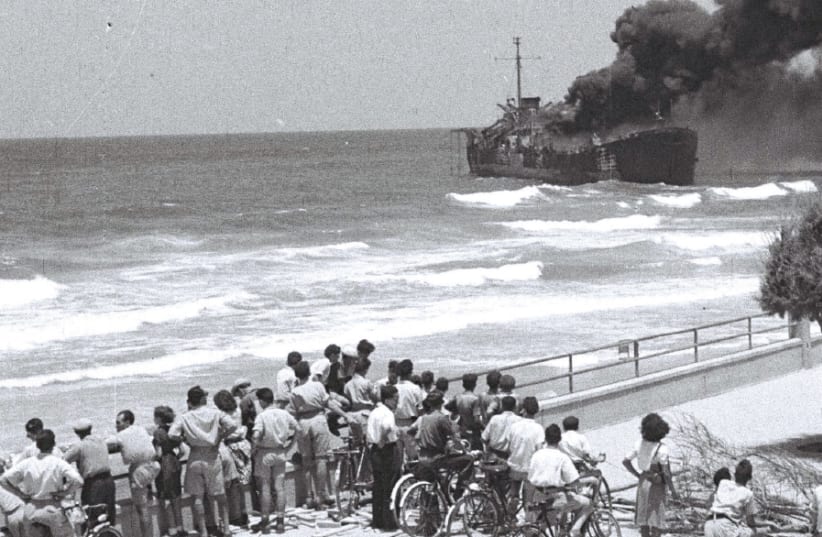 BYSTANDERS WATCH as the ‘Altalena’ burns after being shelled near Tel Aviv on June 22, 1948 (photo credit: Wikimedia Commons)