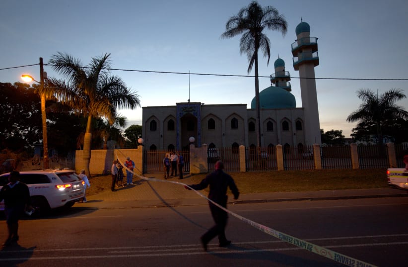 File photo: Police investigators collect evidence at a mosque where three men were attacked in Ottawa, South Africa, May 10, 2018 (photo credit: ROGAN WARD / REUTERS)