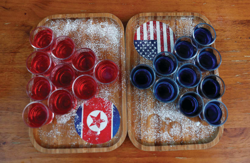 SPECIAL RED AND BLUE shots offered at Escobar bar to mark the summit meeting between Donald Trump and Kim Jong Un are displayed on a table in Singapore last week. (photo credit: EDGAR SU/ REUTERS)