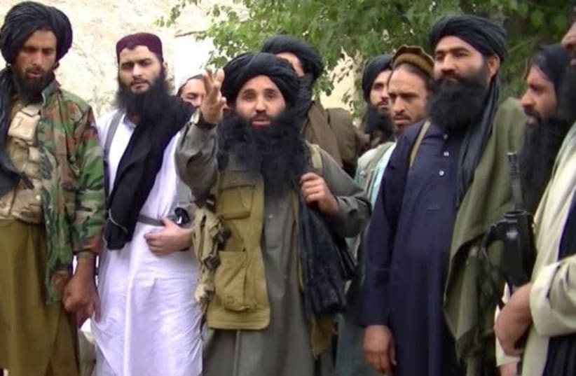 Mullah Fazullah (center) is shown in a video released by the Pakistan Taliban (photo credit: screenshot)