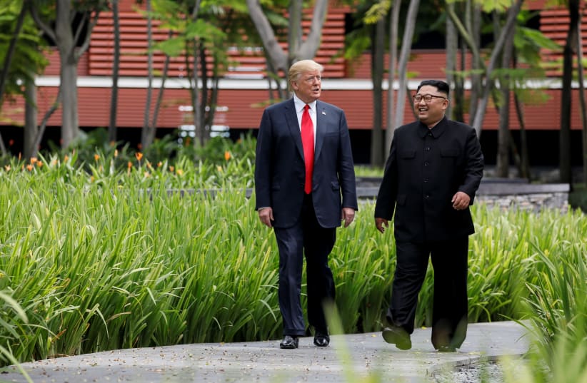 US PRESIDENT Donald Trump and North Korean dictator Kim Jong Un enjoy a stroll during their historic meeting. (photo credit: REUTERS)