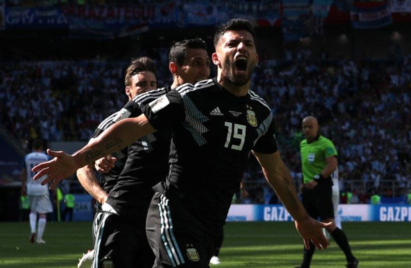 Argentina's Sergio Aguero celebrates scoring the side's first goal in a World Cup match against Iceland, June 16, 2018 (photo credit: ALBERT GEA/ REUTERS)
