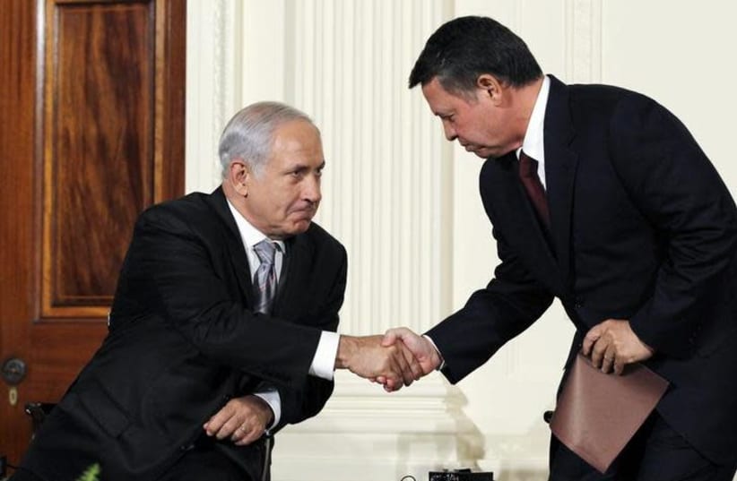 Jordan's King Abdullah II (R) greets Israeli Prime Minister Benjamin Netanyahu in 2010 (photo credit: JASON REED/REUTERS)