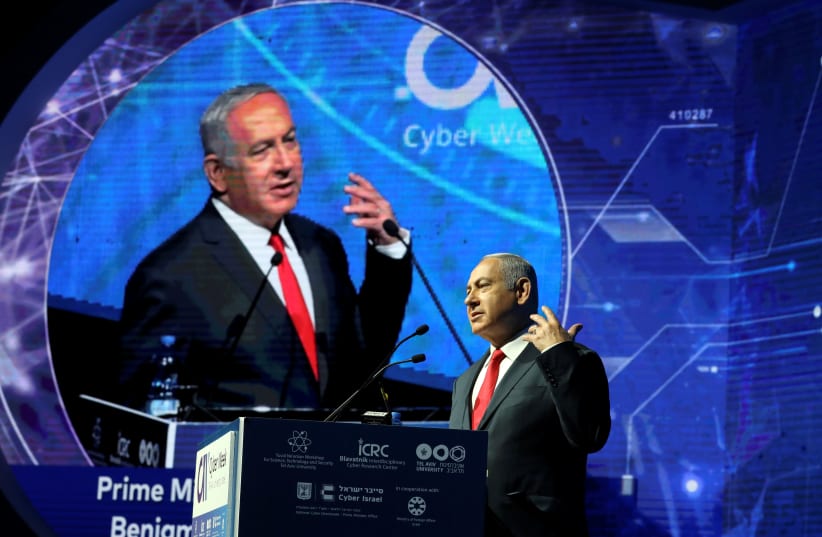 Israeli Prime Minister Benjamin Netanyahu gestures as he speaks during the Cyber Week conference at Tel Aviv University (photo credit: AMMAR AWAD/REUTERS)