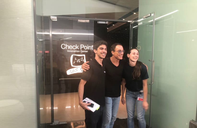  Jean Claude Van Damme (C) poses for a photo at Check Point in Tel Aviv, June 20th, 2018 (photo credit: COURTESY CHECK POINT)