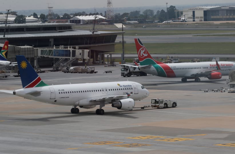 DATE IMPORTED: March 10, 2017 Air Namibia (L) and Kenya Airways aircraft are parked at the OR Tambo International Airport in Johannesburg, South Africa (photo credit: SIPHIWE SIBEKO/REUTERS)