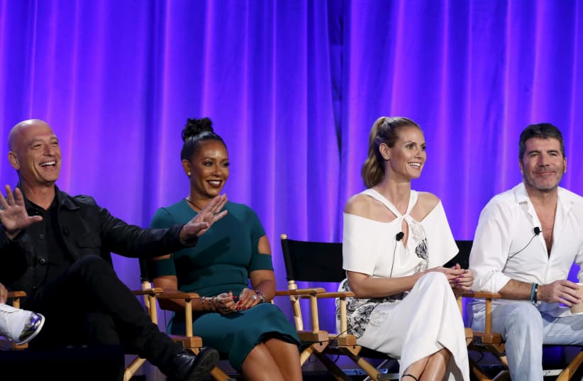 Howie Mandel, Melanie Brown, Heidi Klum and Simon Cowell attend a panel for the television show "America's Got Talent" (photo credit: MARIO ANZUONI/REUTERS)
