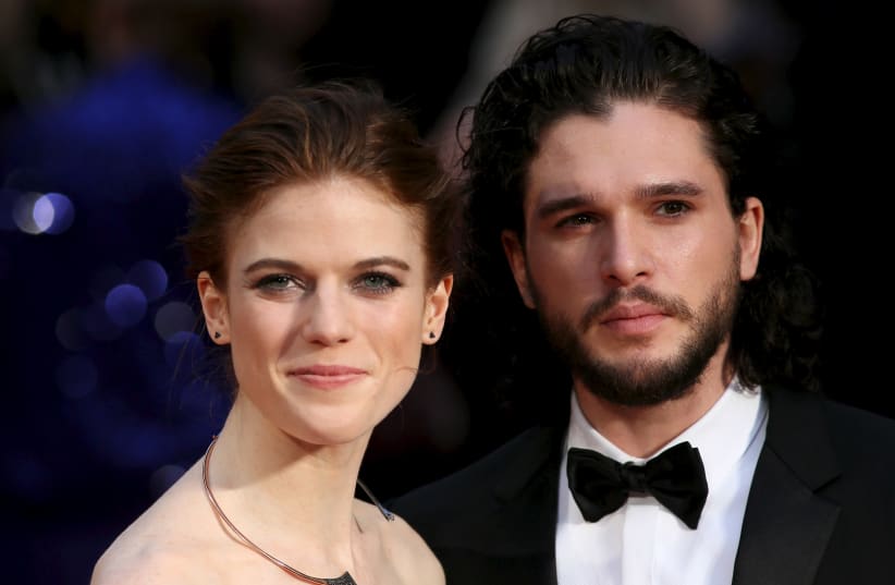 Actor Kit Harington (R) and actress Rose Leslie (L) pose for photographers as they arrive at the Olivier Awards at the Royal Opera House in London, Britain April 3, 2016. (photo credit: NEIL HALL/REUTERS)