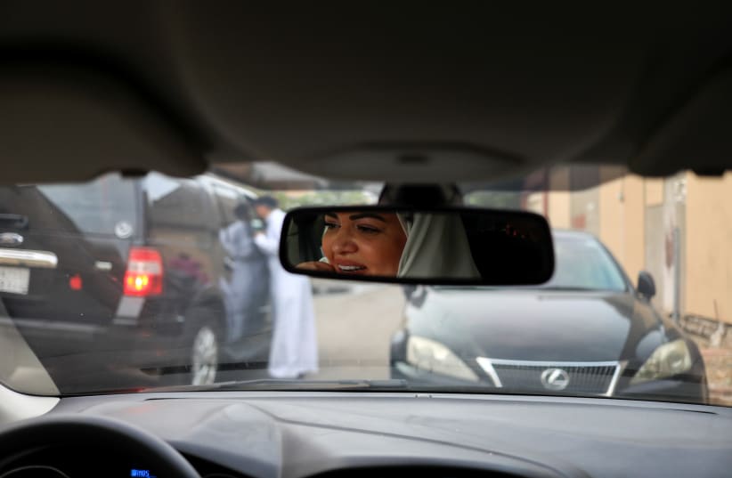 Dr Samira al-Ghamdi, 47, a practicing psychologist, drives around the side roads of a neighborhood as she prepares to hit the road as a licensed driver (photo credit: ZOHRA BENSEMRA/REUTERS)