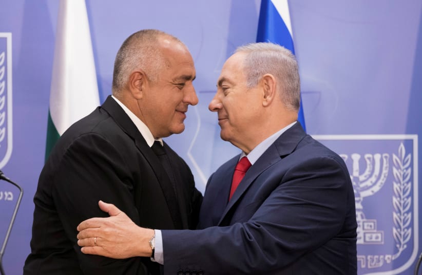 Israeli Prime Minister Benjamin Netanyahu hugs with Bulgarian Prime Minister Boyko Borissov during a meeting at the prime minister's office in Jerusalem, June 13, 2018. (photo credit: ABIR SULTAN / REUTERS)