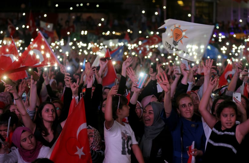 AK Party supporters celebrate in front of the AKP headquarters in Ankara, Turkey June 24, 2018 (photo credit: STOYAN NENOV/REUTERS)