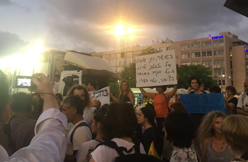 DEMONSTRATORS PROTEST the segregation of genders at a Chabad event in Rabin Square in Tel Aviv, June 25, 2018 (photo credit: NAOMI GRANT)