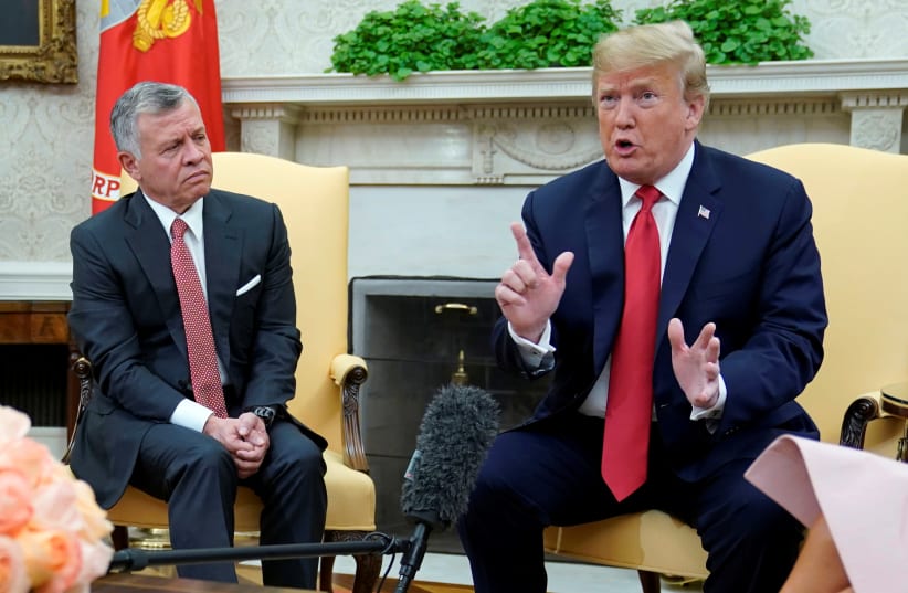 US President Donald Trump speaks to reporters while meeting with Jordan’s King Abdullah in the Oval Office at the White House in Washington, US, June 25, 2018 (photo credit: REUTERS/JONATHAN ERNST)
