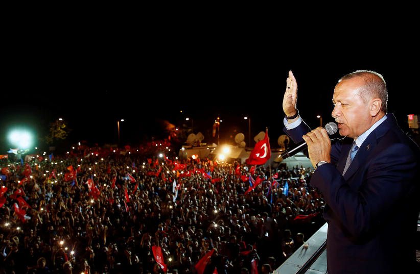 Turkish President Tayyip Erdogan addresses his supporters in Istanbul, Turkey June 24, 2018 (photo credit: KAYHAN OZER/PRESIDENTIAL PALACE/HANDOUT VIA REUTERS)