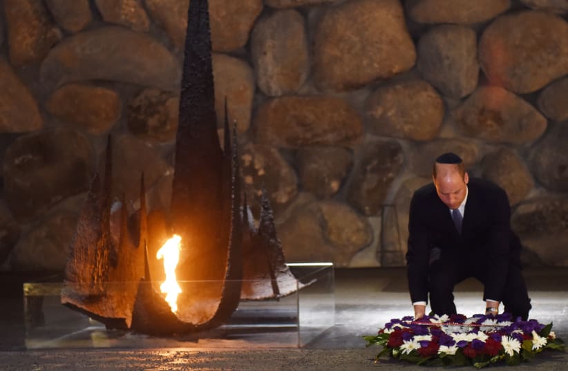 Britain's Prince William lays a wreath during a ceremony commemorating the six million Jews killed by the Nazis in the Holocaust, in the Hall of Remembrance at Yad Vashem (photo credit: DEBBIE HILL/REUTERS)