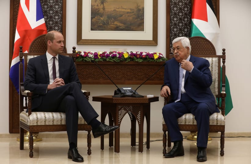Palestinian President Mahmoud Abbas gestures during his meeting with Britain's Prince William in Ramallah, June 27, 2018 (photo credit: ALAA BADARNEH/POOL VIA REUTERS)