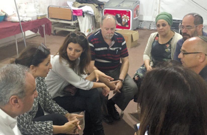 MK ORLY LEVY-ABEKASIS (center) takes a seat in the protest tent (photo credit: YONATAN PELEG)