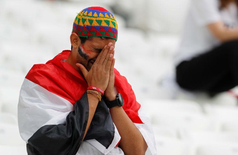 An Egypt fan looks dejected after his country's match vs Saudi Arabia at the World Cup, June 25, 2018 (photo credit: REUTERS/DARREN STAPLES)