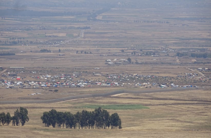 Mount Peres on the Syria border with the Golan showing Syrian IDPs crowded near Al-Rafid on the ceasefire line, June 30, 2018. (photo credit: SETH J. FRANTZMAN)
