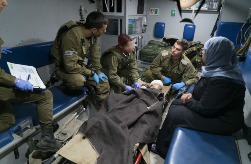 IDF gives urgent treatment to Syria refugees, June 30, 2018. (photo credit: IDF SPOKESMAN’S UNIT)