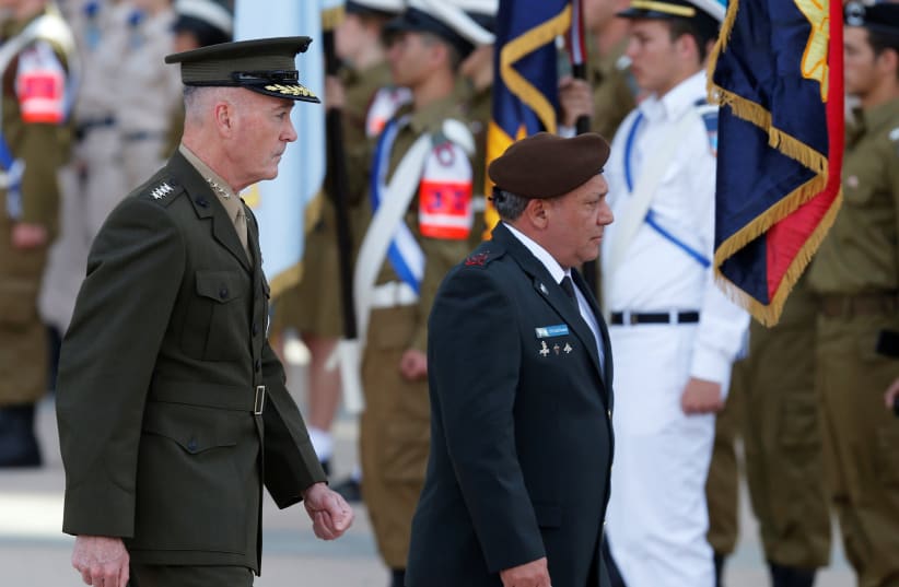 General Joseph Dunford (L), the Chairman of the U.S. Joint Chiefs of Staff, walks next to Israel's Chief of Staff Lieutenant-General Gadi Eizenkot, as they review an honour guard in Tel Aviv, Israel May 9, 2017. (photo credit: NIR ELIAS / REUTERS)