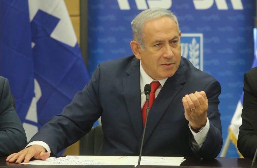 Prime Minister Benjamin Netanyahu gestures during a Likud faction meeting, July 2 2018 (photo credit: MARC ISRAEL SELLEM/THE JERUSALEM POST)