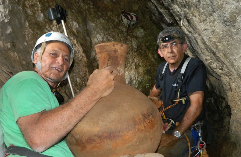 Dr. Danny Sion (right) of the Israel Antiquities Authority and  Dr. Yinon Shivtiel of Safed Academic College in the cave. (photo credit: OMRI GESTER/ISRAEL ANTIQUITIES AUTHORITY)