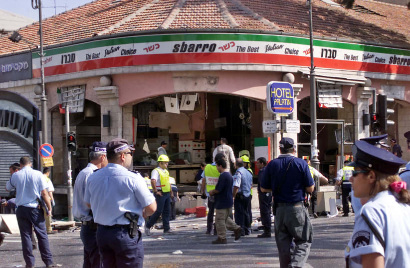 A gaping hole is left in the shop front of the Sbarro pizzeria after a suicide bombing, August 9, 2001 (photo credit: REUTERS)