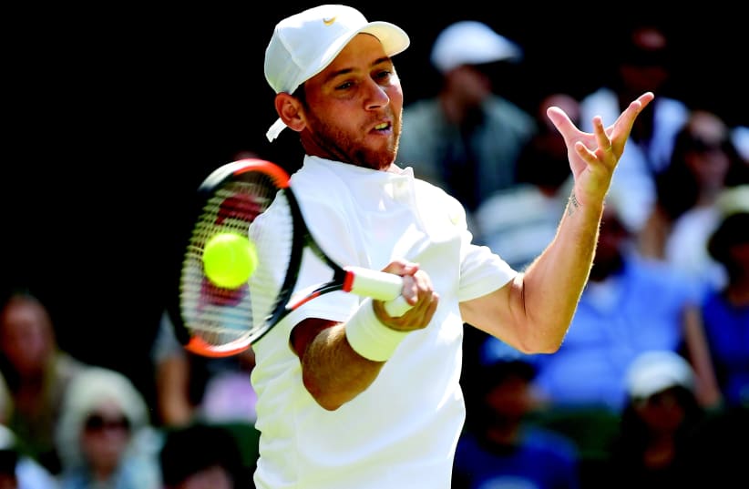 ISRAEL’S DUDI SELA in action during yesterday’s first-round match against Spain's Rafael Nadal at Wimbledon, which Nadal won in straight sets.  (photo credit: REUTERS)