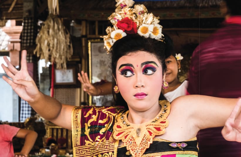 A YOUNG Balinese dancer performs in traditional dress (photo credit: YOAV DIKSTEIN)