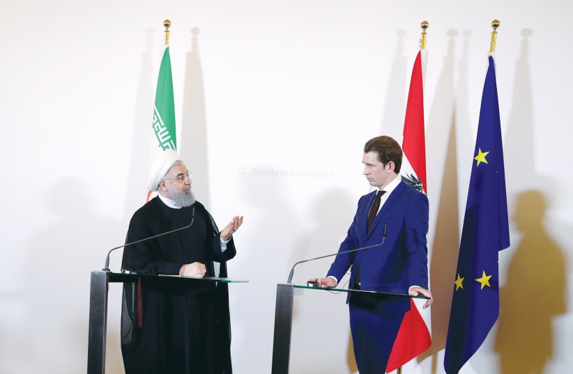 IRAN PRESIDENT Hassan Rouhani and Austrian Chancellor Sebastian Kurz attend a news conference at the Chancellery in Vienna.  (photo credit: REUTERS/LISI NIESNER)