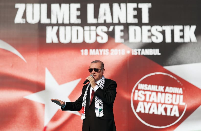 TURKISH PRESIDENT Tayyip Erdogan delivers a speech during a protest against the recent killings of Palestinian protesters on the Gaza-Israel border and the US embassy move to Jerusalem, in Istanbul, Turkey on May 18. (photo credit: REUTERS)