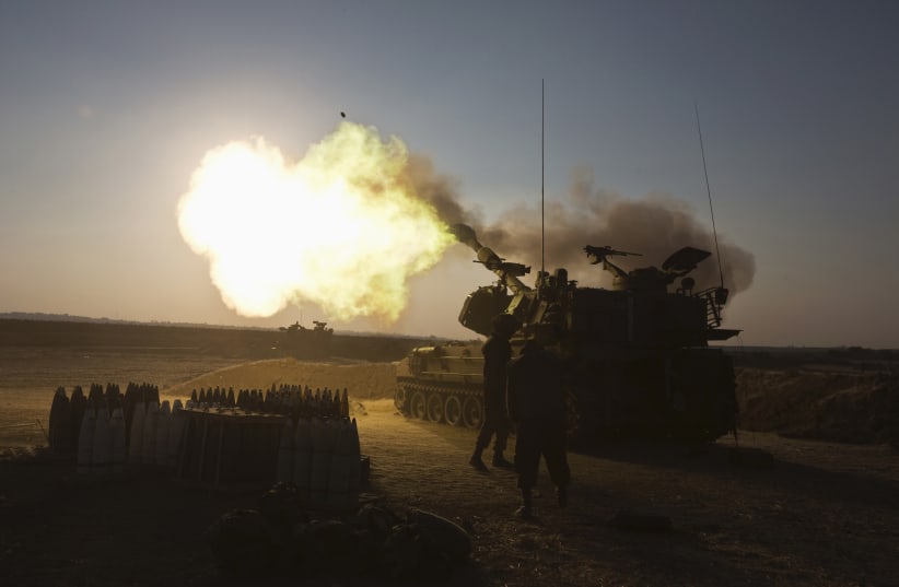 An Israeli mobile artillery unit fires towards the Gaza Strip July 21, 2014 (photo credit: REUTERS/NIR ELIAS)