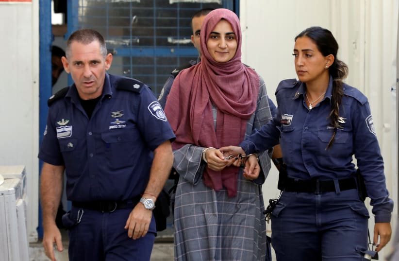 Turkish citizen, Ebru Ozkan, who was arrested at an Israeli airport last month, is being brought to an Israeli military court, near Migdal, Israel July 8, 2018 (photo credit: REUTERS/NIR ELIAS)