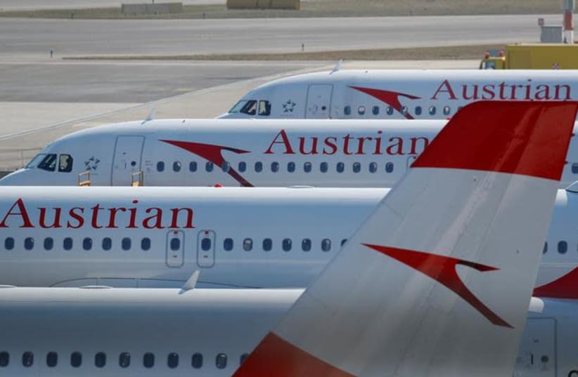 Planes of Lufthansa unit Austrian Airlines are parked at Vienna International Airport in Schwechat, Austria March 22, 2018 (photo credit: REUTERS/LEONHARD FOEGER)
