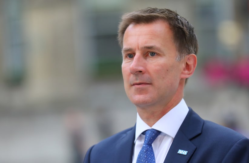 Britain's Secretary of State for Health and Social Care Jeremy Hunt arrives at the BBC in central London, Britain, July 9, 2018 (photo credit: REUTERS/SIMON DAWSON)