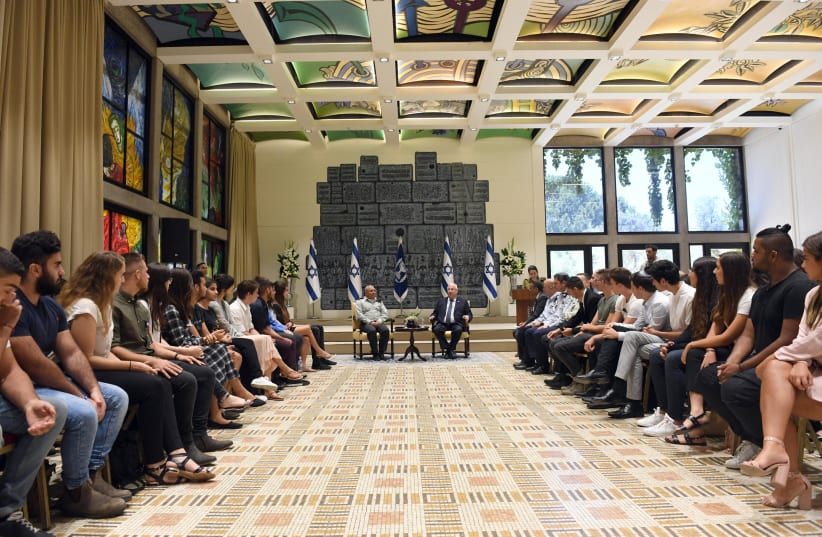 President Reuven Rivlin and Chief of Staff Lt.Gen. Gadi Eisenkot meeting with 70 influential teenagers at the President's residence on Tuesday, July 10, 2018.  (photo credit: HAIM ZACH/GPO)