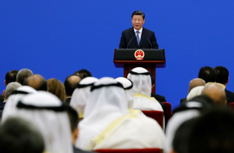 Chinese President Xi Jinping speaks to representatives of Arab League member states at a China Arab forum at the Great Hall of the People in Beijing, China, July 10, 2018.  (photo credit: THOMAS PETER/REUTERS)