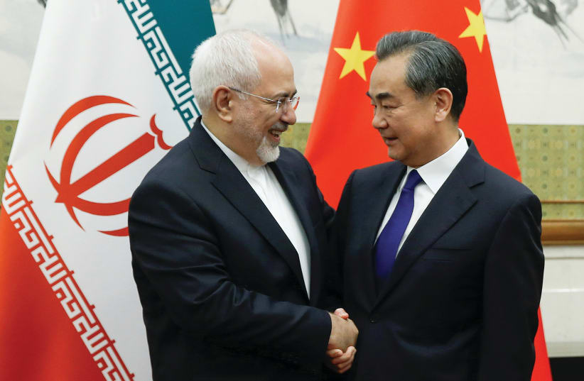 Chinese Foreign Minister Wang Yi meets Iranian Foreign Minister Mohammad Javad Zarif in Beijing in May (photo credit: THOMAS PETER/REUTERS)