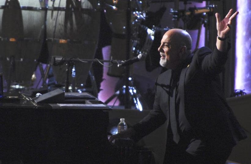 Recording artist Billy Joel, the latest recipient of the Gershwin Prize for Popular Song, is honored during a tribute concert at DAR Constitution Hall in Washington, November 19, 2014. (photo credit: REUTERS/MARY F. CALVERT)