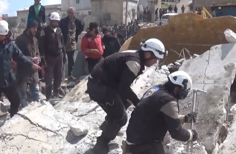 White Helmets of the Syrian Civil Defense in Kafrowaid, a village near Idlib in Syria (photo credit: Wikimedia Commons)