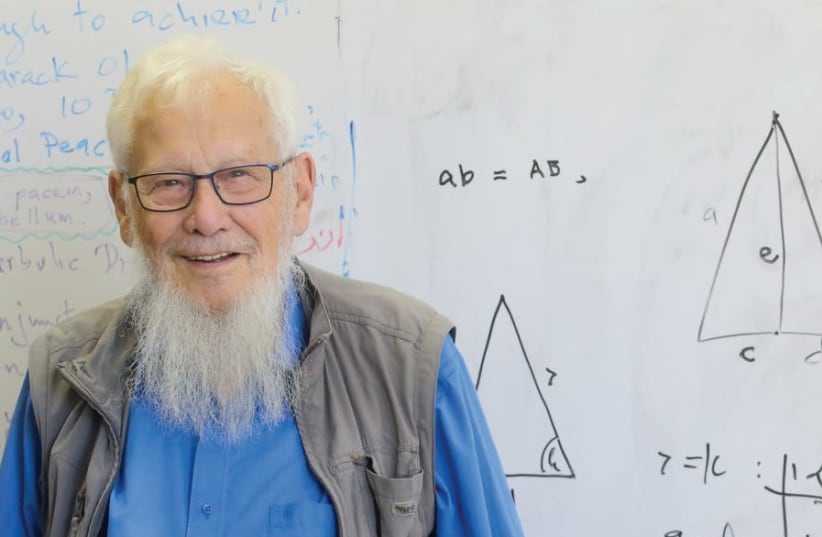 Prof. Yisrael Aumann stands in front of the board in his office (photo credit: MARC ISRAEL SELLEM)