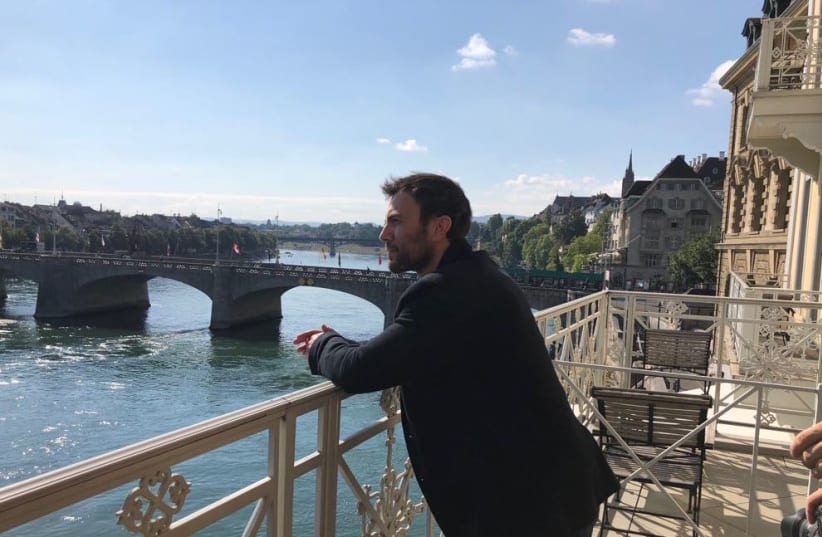 Paralymic tennis player Noam Gershony poses on Theodor Herzl's balcony, recreating the iconic photograph (photo credit: IFAT SHOMRONY & EYAL BEN ZEEV COMMUNICATIONS)