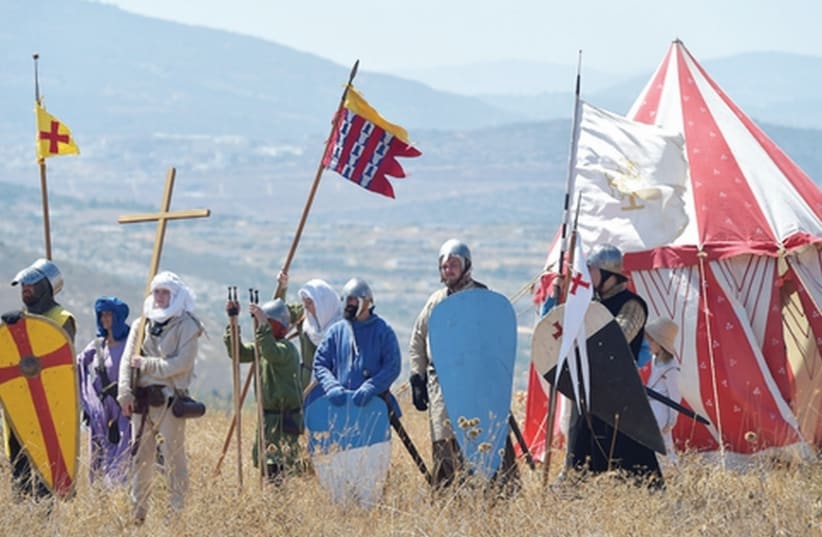 A GROUP of about 20 men take part in a three-day reenactment of the Battle of Hattin, which climaxed with the beheading of Raynald de Châtillon at Horns of Hattin, overlooking the Kinneret. (photo credit: MEIR VAKNIN/FLASH90)