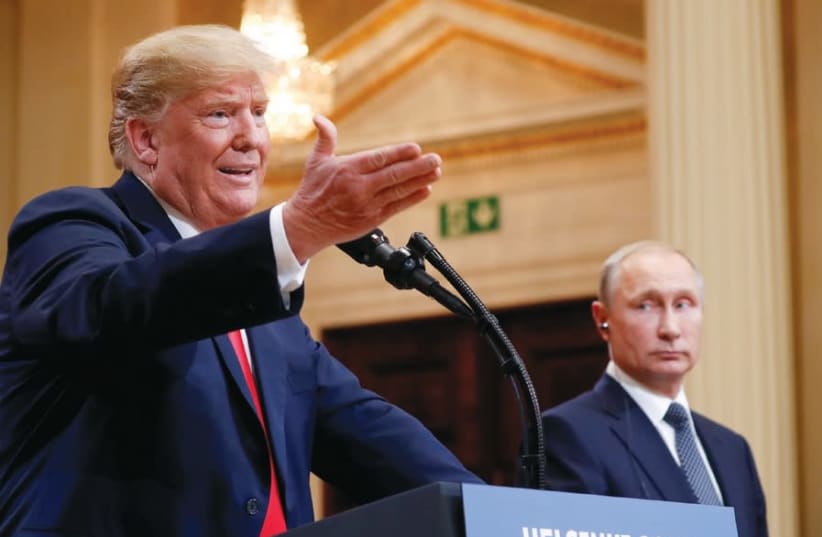 US PRESIDENT Donald Trump gestures during a joint news conference with Russia’s President Vladimir Putin after their meeting in Helsinki, Finland, July 2018 (photo credit: KEVIN LAMARQUE/REUTERS)