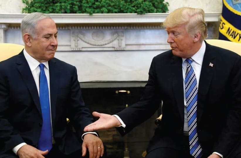 PRIME MINISTER Benjamin Netanyahu meets with US president Donald Trump in the Oval Office of the White House in Washington, 2018 (photo credit: KEVIN LAMARQUE/REUTERS)