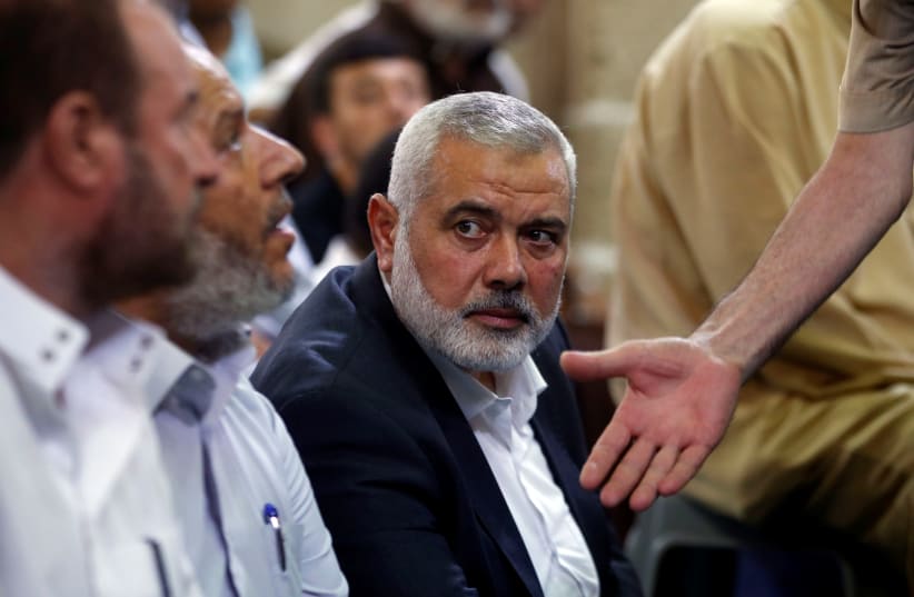 Hamas Chief Ismail Haniyeh looks on as he attends the funeral of Palestinian Hamas militants who were killed in Israeli tank fire, at a mosque in Gaza City July 26, 2018 (photo credit: MOHAMMED SALEM/REUTERS)