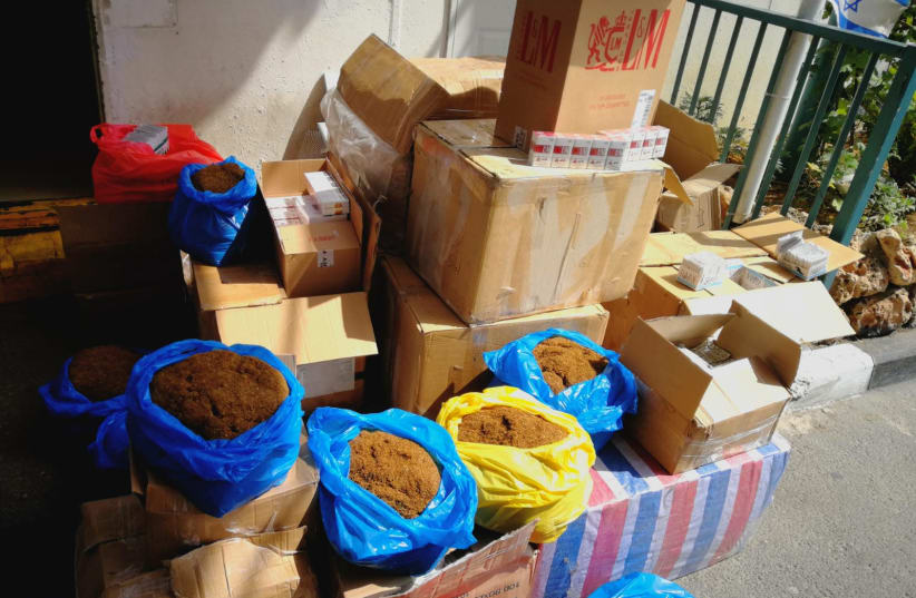 Captured counterfeit tobacco and cigarettes (photo credit: DEFENSE MINISTRY)