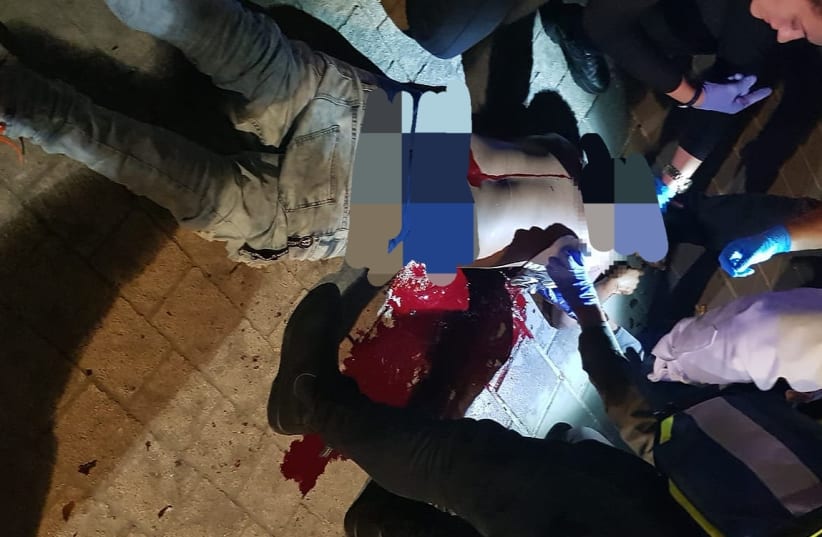 Police find stabbing victim lying in pool of blood on Finn Street in south Tel Aviv (photo credit: ISRAEL POLICE)